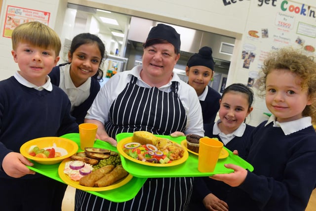 Stanhope Primary School cook Lynn Curtin was pictured ahead of International School Meals Day in 2017 with Cody Headley, Bisma Khawaja, Jaspreet Singh, Jessica Paul, and Emily Kouhy.