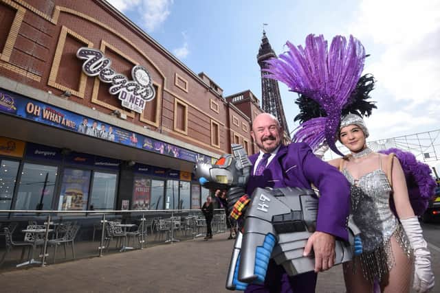 K9 pays a visit to Leye D Johns at Viva Blackpool to promote the Dr Who Convention on April 30.  They are pictured with Viva Showgirl Hannah Hugo.