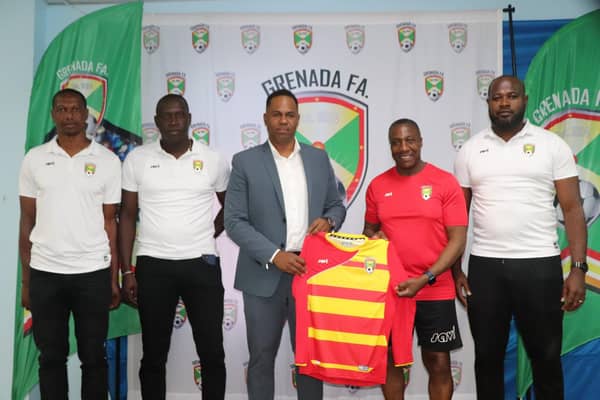 Terry Connor, central, has taken charge of Grenada's national team