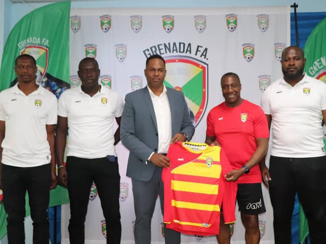 Terry Connor, central, has taken charge of Grenada's national team