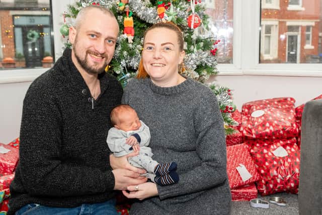 Samantha Fellows and Chris George with new baby Coady-Louis. Photo: Kelvin Stuttard