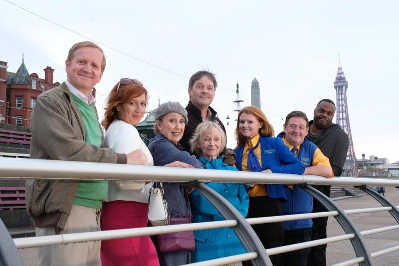 Filming in Blackpool for Gold TV comedy Murder on the Blackpool Express, starring Johnny Vegas in 2017. L-R: Matthew Cottle, Katy Cavanagh, Una Stubbs, Sheila Reid, Mark Heap, Sian Gibson, Johnny Vegas, Javone Prince. It was a whodunnit mystery. Rating 6.2