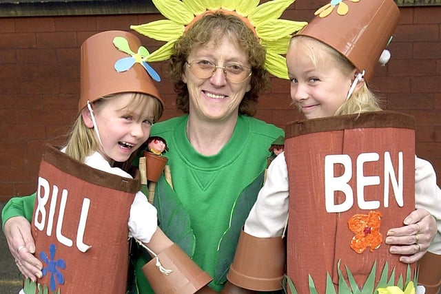 Golden Jubilee party at Waterloo Primary School, Blackpool. Special Support Assistant Jane Lloyd as Little Weed, with Chloe Waine (6)and her sister Jodie (9) as Bill and Ben the flowerpot men