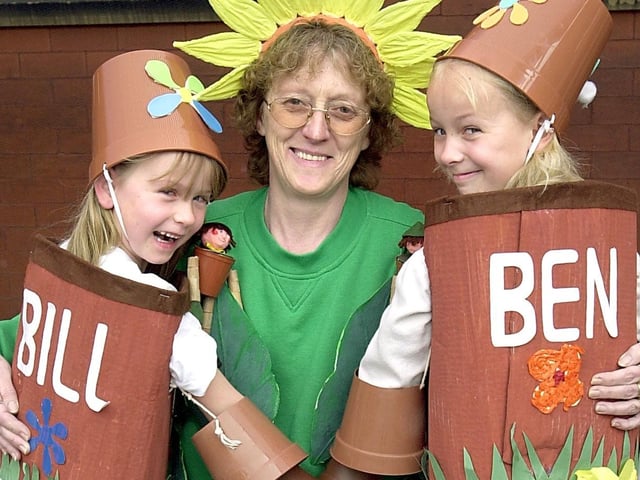 Golden Jubilee party at Waterloo Primary School, Blackpool. Special Support Assistant Jane Lloyd as Little Weed, with Chloe Waine (6)and her sister Jodie (9) as Bill and Ben the flowerpot men
