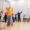 Mel Brierley (in yellow) running a Dance for Parkinson's session