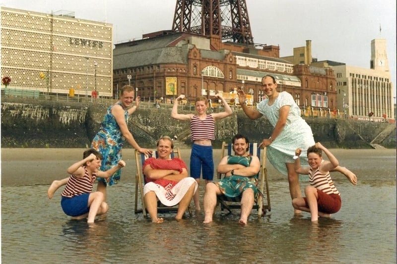 On the beach in 1988, three young members of the Gang Show cast pose with (back left) Mark Wilson, (front left) Keith Winters, (front right) Peter Burgeen and (back right) Dave Swift