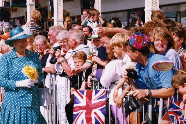 Excited people gather to see the Queen as she visits Blackpool