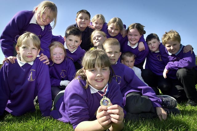 The swimming team from Boundary Primary School had an individual winner in the Blackpool Schools Gala in 2002. Hollie Clarke (11) with her medal for the front crawl, and the rest of the team