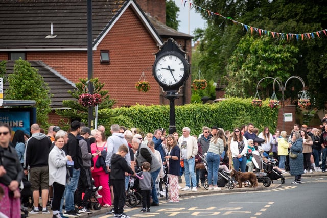 Spectators eagerly await the Freckleton Club Day procession.