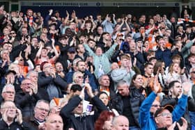 Blackpool fans applaud their team at the final whistle