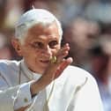 Pope Benedict XVI waves to crowds in 2012