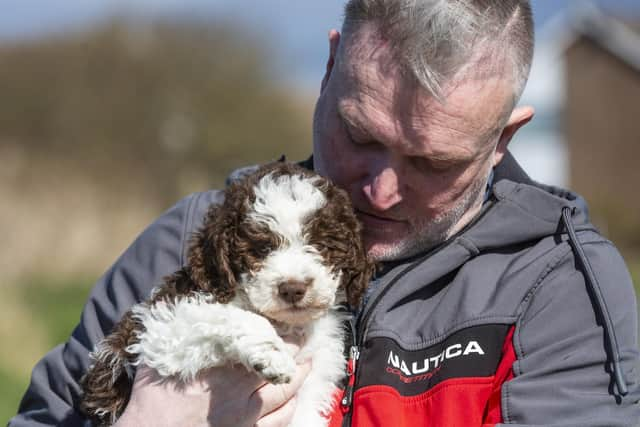 Adam Clark, 51, with his new puppy Ollie