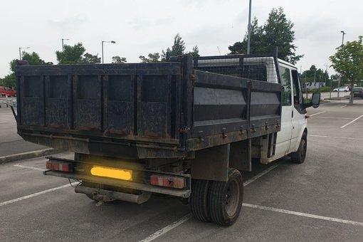 This truck was stopped at a checksite and was prohibited from driving on the road when several defects found, including four out of six indicator lights were defective, no side lights, a persishing tyre, and a seatbelt not anchored to the floor.