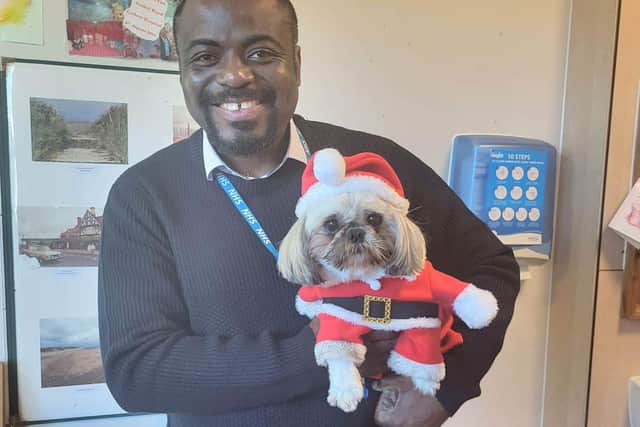 Minnie the therapy dog with Dr.Chukwuna at The Harbour hospital, Blackpool.