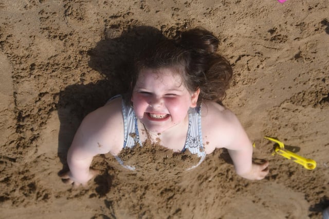 Lacey Kerrigan, seven, was eager to get deep into wet sand on Blackpool beach.