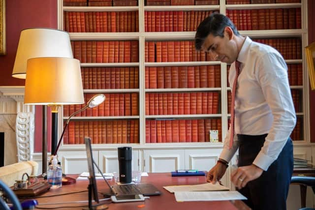 Rishi Sunak with his £180 'smart mug' (credit Simon Walker HM Treasury PA)