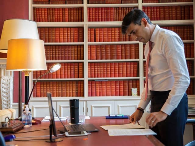 Rishi Sunak with his £180 'smart mug' (credit Simon Walker HM Treasury PA)