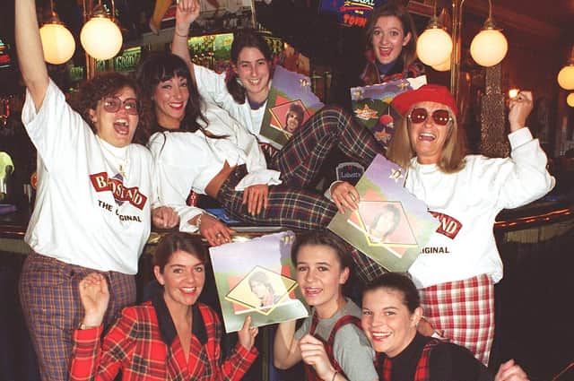 Local Bay City Rollers fans at Uncle Toms Cabin in 1996.  Back, from left, Jean Aspinall, Lorraine Wragg, Amanda Marshall, Catherine Worrall, Lyn Jones. Kneeling, from left, Karen Dewhurst, Katie Mackintosh  and Julie  Killiner