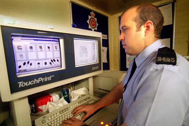 PC Gary Cross with a new high-tech finger printing machine at Blackpool Police Station in 1997