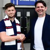 Director of football Chris Beech (right) welcomes latest signing Owen Evans to AFC Fylde