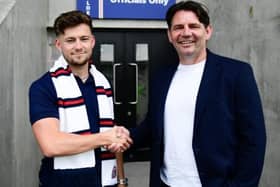 Director of football Chris Beech (right) welcomes latest signing Owen Evans to AFC Fylde