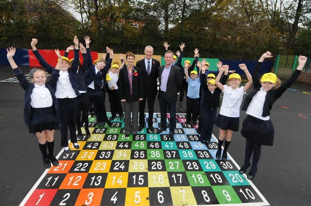 These pupils look delighted with the new playground markings at Mortimer Primary School. Remember this from 2011?