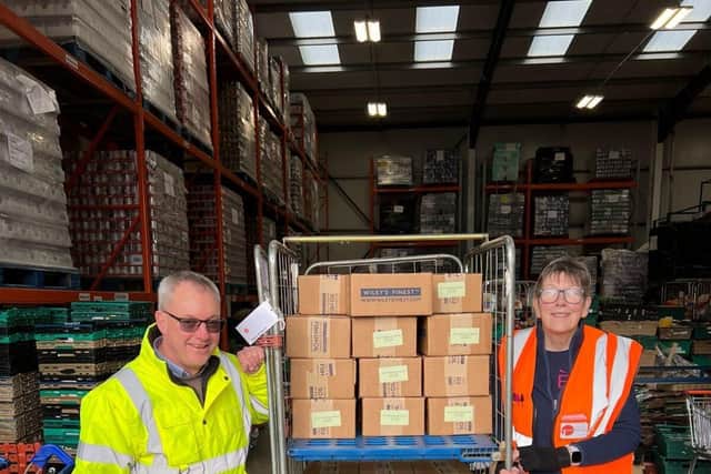 Wiley's Finest MD Paul Farquhar with Blackpool Food Bank warehouse manager Jackie Knight