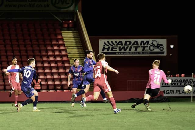 Nick Haughton opens the scoring for AFC Fylde at Kidderminster Photo: STEVE MCLELLAN
