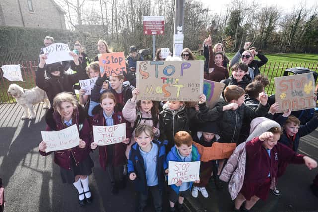 Residents protest with parents and pupils of Thornton Cleveleys Baines Endowed Primary School over plans to install a 5G mast outside the outdoor learning and woodland area.