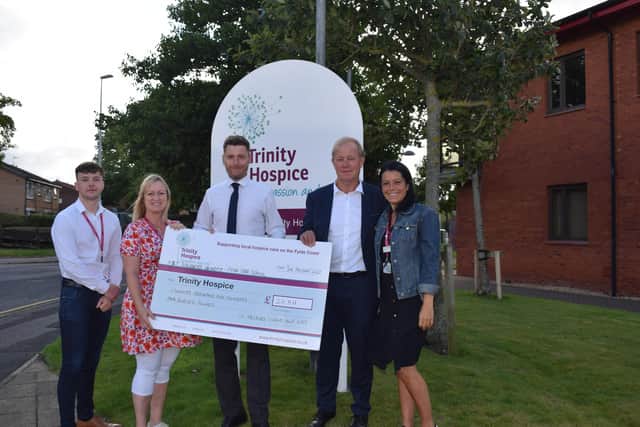 St George’s Golf Day organisers Mick Threlfall and Mark Leech present a cheque for £20,511 to Trinity Hospice, to be split between Trinity, ABF The Soldiers’ Charity
and Pear Tree Holiday Club. It takes the event’s fundraising to over £100,000 for local charities