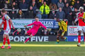 Fleetwood Town goalkeeper Kieran O'Hara clears his lines on his debut at former club Burton Albion.