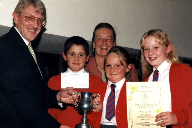 Pupils from Clifton Primary School are pictures receiving the Guardian Schools Trophy from Trevor Taylor back in 1998