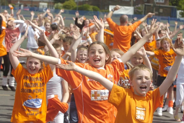 Over 600 pupils at Layton Primary School dance to 'Glad All Over' in support of Blackpool Football Club