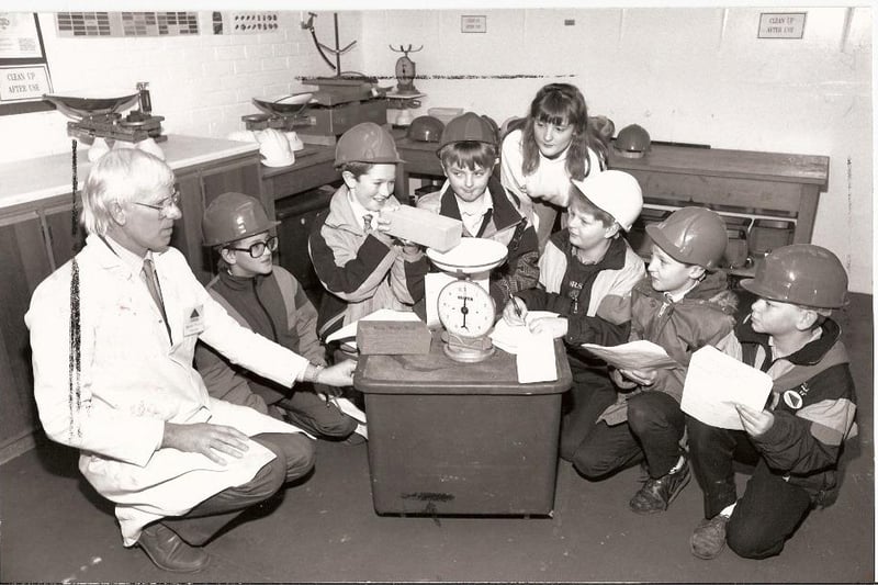 Anchorsholme Primary School pupils visit Blackpool and Fylde College in 1991. Tony Ashton, senior lecturer in surveying, supervises the children weighing building materials. From left:  Mr Ashton, Andrew Crump, Andrew Dawson, Mark Coop, student Ellis Logan, Andrew Ward, Toby Colson and Darren Pilkington.