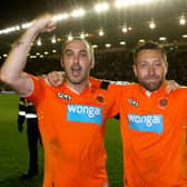 Dobbie celebrates with Gary Taylor-Fletcher after helping Blackpool qualify for the Championship play-off final in 2012
