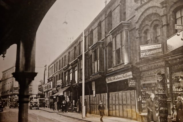 The caption on the back of thisd 1935 photo says - 'Another part of old Blackpool is going. The old buildings in Bank Hey Street, which are said to date back to 1840, and have been something of an eyesore as auctioneers' and rock sellers' stands, are being demolished and replaced by ultra modern shops with cream and green frontage. They were talking about Lewis's