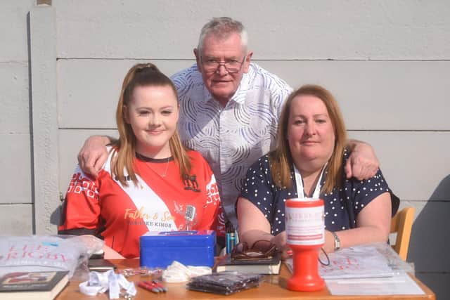 Lee Rigby FC play Hurt Plant Hire in a charity football match at AFC Blackpool. Pictured are Amy, Ian and Lyn Rigby.