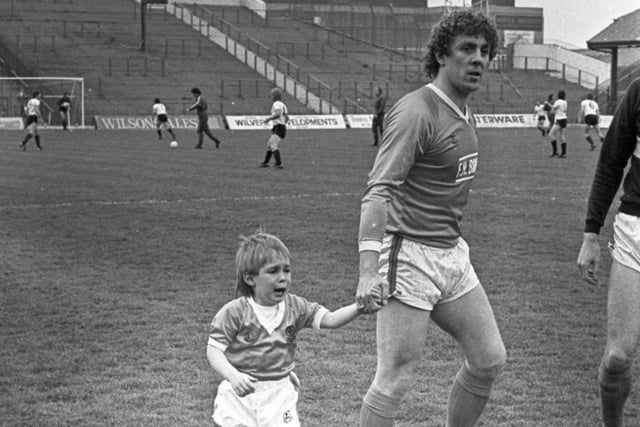 Keith Mercer with his son on the pitch before kick off