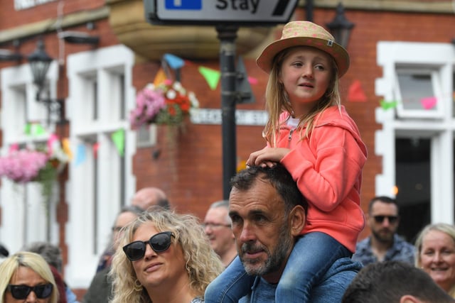 This youngster was given a helping hand to ensure the best view as the procession went by along Clifton Street