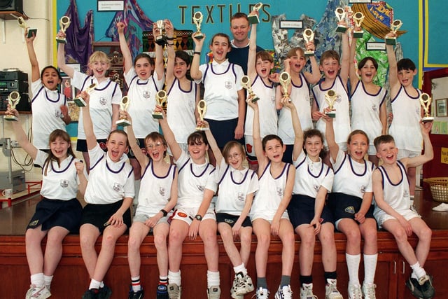 Thames County Primary School athletics team, who were successful at the Blackpool and Fylde Indoor Athletics Championships in 1997. They are pictured with their coach Stephen Staveley