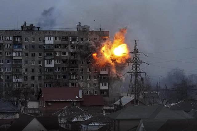 Photo by Evgeniy Maloletka/AP/Shutterstock (12846148a)
An explosion is seen in an apartment building after Russian's army tank fires in Mariupol, Ukraine
Russia War Day In Photos, Mariupol, Ukraine - 11 Mar 2022