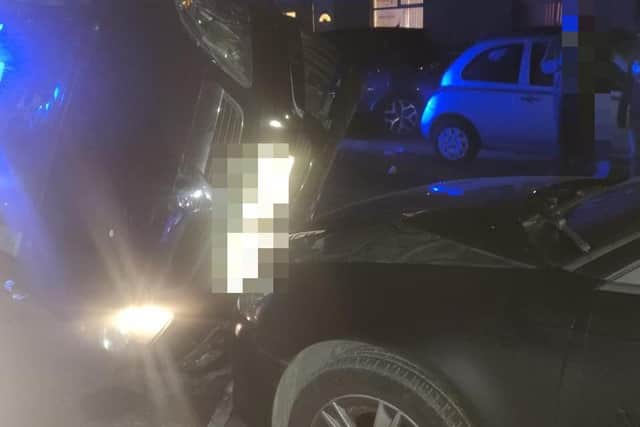 A 40-year-old man was arrested on suspicion of driving with excess alcohol after a car crashed into four parked cars