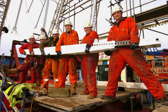 The Big Wheel going up again on Blackpool's Central Pier. Putting the final ring beam in are, from left, Simon Bornand, Shane Taylor, Michael Docherty, Tony Lister, Anne Wilson, and Alan Price