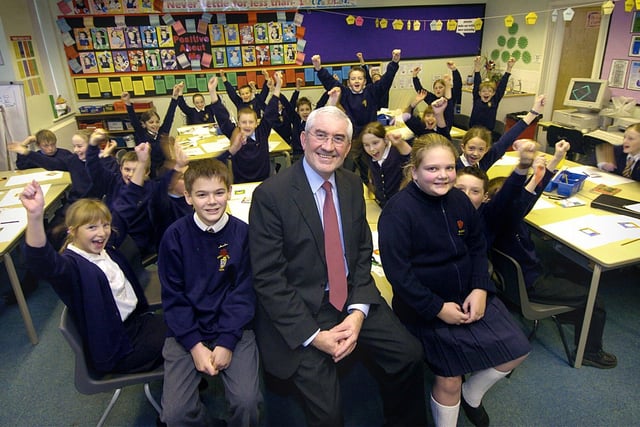 Pupils at Anchorsholme Primary School celebrate after their school joined the OFSTED hall of fame, one of only 234 in the country to have two consecutive 'outstanding' inspections. Pictured in the foreground are Head Mike Bryan with Head Boy and Girl Christopher Morris and Melanie Kane, 2005