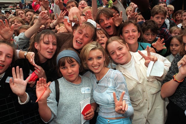 Dannii Minogue meets the crowd during a broadcast from Blackpool Pleasure Beach for the Big Breakfast