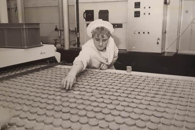 Biscuits on the conveyor belt, baked and ready for the next stage of production at the Fox's Biscuits factory in Kirkham