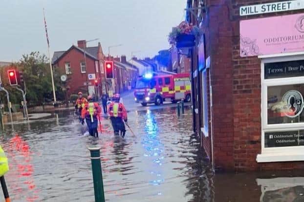 Torrential rain flooded the area at Mill Street