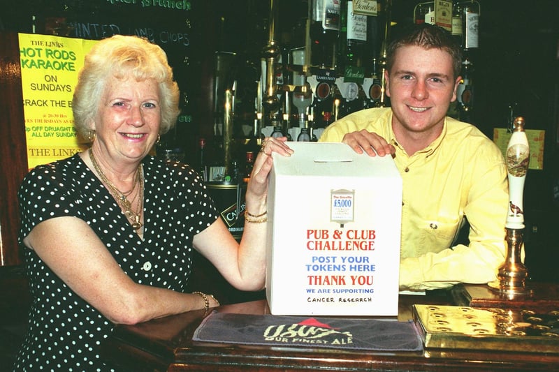 Betty Lawton-Landlady of the Links Hotel St Annes and Assistant Manager Ian Ellis with the Pub and Club Challenge box in 1999