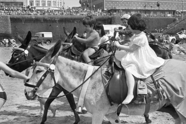 Youngsters enjoying the donkey rides on the beach at Blackpool in the summer of 1985