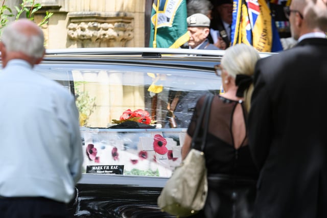 Spencer's coffin was decorated and adorned with poppies in fitting tribute to his fund-raising exploits. Photo: Kelvin Stuttard
